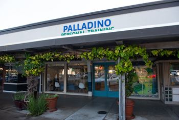 A Palladino sign is on the top of a building.